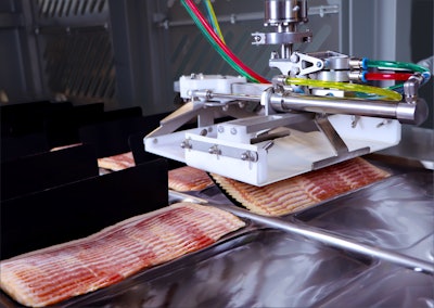 JLS Automation's Harrier Bacon Draft Loading System loads bacon drafts into thermoformed packages.