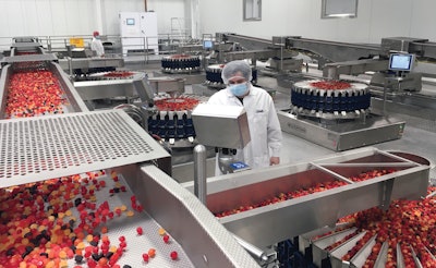 PIM Brands’ Chris Greco checks production settings on one of the many HMIs provided by Multipond.