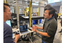 Zenni Director of Distribution and Facilities Simon Goh (right), talks about the deployment now underway with OSARO’s Bryan Yong, a Senior Solutions Engineer at the AI robotics company's San Francisco Robot Lab.