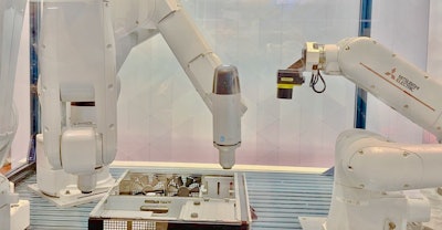 Mitsubishi’s Assista cobot and RV-7FRL and RV-8CRL industrial robots in a complex path screw-driving assembly operation at IMTS 2022.