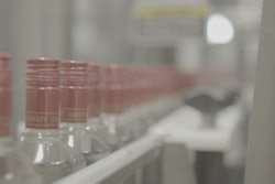 Smirnoff glass bottles on conveyor