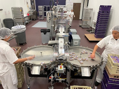 Workers still have to load larger-sized brownies into totes by hand, but the new system enables double packaging capacity