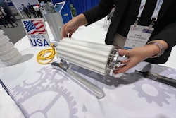 Sonia Kanaris demonstrates the easy removal of a profiled, nylon continuous sleeve on this drum motor at PACK EXPO International.