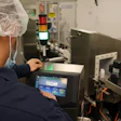 Mechanic using HMI to setup a VJ 1280.