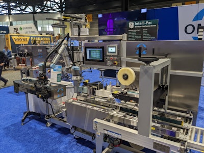 Omega Design Corporation exhibited its Cobot Pack Assist for the Intelli-Pac unit, loading multiple containers into a formed box.