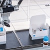 Labeled vials are loaded into cartons.