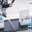 Labeled vials are loaded into cartons.