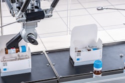 Labeled vials are loaded into cartons.