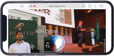 A real, live interactive experience on a smartphone at the World Congress while Martin Stahel, sales director of augmented reality provider Zappar, presents.