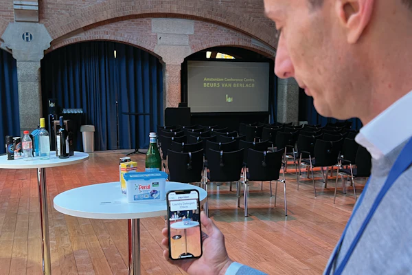 Stahel demonstrates Zapvision at his booth at AIPIA. The system allows a smartphone to read an on-pack QR code at a distance. For a user with sight limitation, more information becomes available on the screen—in large text or with audio—as he or she moves closer to a product on the shelf.