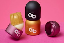 A refillable/reusable lip-balm packaging system from above & beyond includes a metallic, dome-shaped case and product refills packaged in bio-based material.