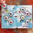 Once opened, the Spice Passport displays a playfully illustrated world map, with spice samples packaged in recyclable aluminum pods slotted into the card according to their country of origin.