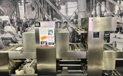 Polypack, Inc. bucket conveyor shrink wrap machine.