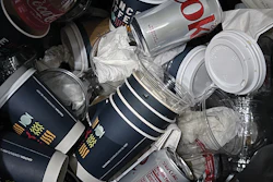 A real image of a trash bin at a sustainable packaging conference.