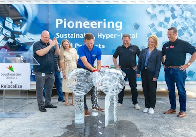SEG’s new autonomous microfactory was unveiled at the grocer’s Jacksonville Distribution Center where a ribbon made of 200 pounds of ice was cut with a chainsaw by SEG’s Chief Merchandising Officer, Dewayne Rabon, joined by SEG and Relocalize leadership.
