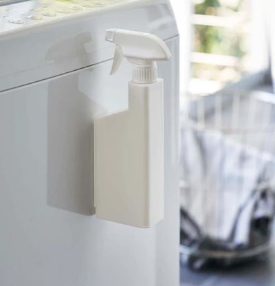 Yamazaki's spray bottle features magnets for easy access.