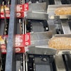 Upstream of secondary packaging, the single-serve pies are loaded into cartons on this system.