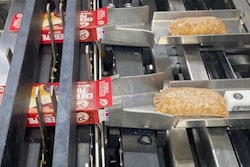 Upstream of secondary packaging, the single-serve pies are loaded into cartons on this system.