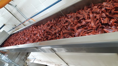 Bacon-shaped dog treats like these start their processing journey as a mix of ingredients in an extruder before they’re shaped and further processed into retail-ready snacks.