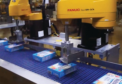 The case packer includes a pair of robots that quickly and efficiently orient cartons into the patterns required.