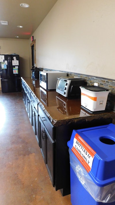 Recycling and compost receptacles inside Yellow Emperor’s employee lounge.