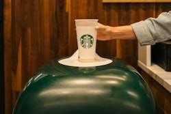 The empty polypropylene cup is recoverable by an in-store return bin that scans, collects, washes, and puts cups back into circulation.