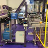 The MFT Tray Former assembles cardboard trays, secures them with hot-melt glue, and delivers them to the next step in the packaging process.