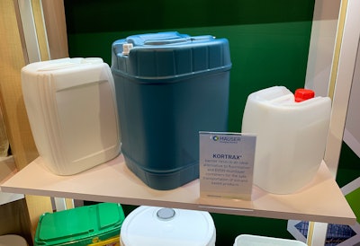 Mauser's UN-rated tight-head container (center), on display at PACK EXPO Las Vegas, is made with 100% post-consumer resin.