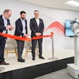 ABB's Marc Segura, John Bubnikovich, and Sami Atiya cut the ribbon at the grand opening of ABB Robotics' renovated facility.
