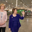 PMMI Chairperson Patty Andersen (left) tours Delkor's facility with Senator Amy Klobuchar.