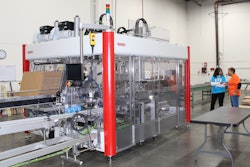 Carolyn Hardy (in blue) and Bernadette Fuller, a University of Tennessee Solutions Consultant, discuss the day’s packaging run using the SOMIC 424 case packing system.