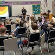 Kevin Pittner teaches second- and third-grade students about the lifecycle of trees.