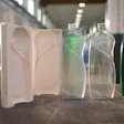 Bottles produced with a 3D printed tool are nearly indistinguishable from the final product produced through traditional metal tooling processes. From left to right: the two-part mold 3D printed with Rigid 10K Resin, a bottle produced with the mold 3D printed with Rigid 10K Resin, a bottle produced with a metal mold, and a labeled prototype bottle for customer testing.