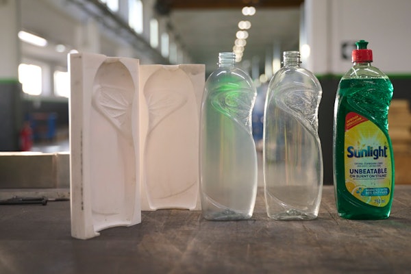 Bottles produced with a 3D printed tool are nearly indistinguishable from the final product produced through traditional metal tooling processes. From left to right: the two-part mold 3D printed with Rigid 10K Resin, a bottle produced with the mold 3D printed with Rigid 10K Resin, a bottle produced with a metal mold, and a labeled prototype bottle for customer testing.