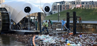 Baltimore's Mr. Trash Wheel collects trash in the city's harbor after a storm.