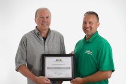 Craig Mast and Kyle Thompson with the award.