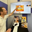 Dalim's Flaurent Epaud demonstrates Dalim ES Fusion platform at drupa, with an example of a chip bag from Swiss brand Zweifel potato chips.