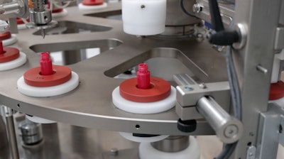 Rotary filling of mascara tubes.