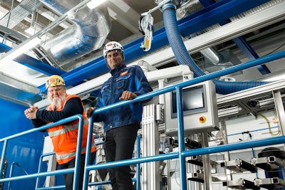 Ali Harlin, research professor at VTT (left), and Dr. Vinay Kumar, senior scientist and project manager at VTT (left) shown on the research center’s CelluloseFilm pilot line in Biorukki, Espoo, Finland.