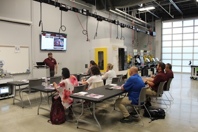CTE instructors from various high school programs get hands-on training with advanced manufacturing technologies at an AiM UP training lab.