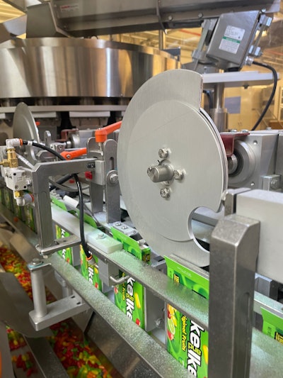 Immediately after being filled the cartons have their top flaps plowed and glued closed.