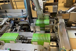 Shown here in the tray packer are one 12-count group of cartons in the flap compression station, another in the tray load station, and a third that is about to be pushed into the tray load station.