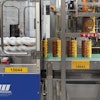 The final set of Morrison timing screws is a stacked screw system that guides stacks of cups forward with just the right spacing so that the Tripack shrink sleever can drop sleeves over paired stacks.