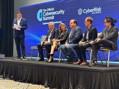 A panel of cybersecurity experts (from left to right: Mans Jabal of Deloitte, Tony Anscombe of ESET, Beth Miller of Code42, Chad Monteith of Pure Storage, Adam Vande Ven of Capital Data, Muamone Yang of Thales) discusses the definition and evaluation of cybersecurity readiness at the Cybersecurity Summit.