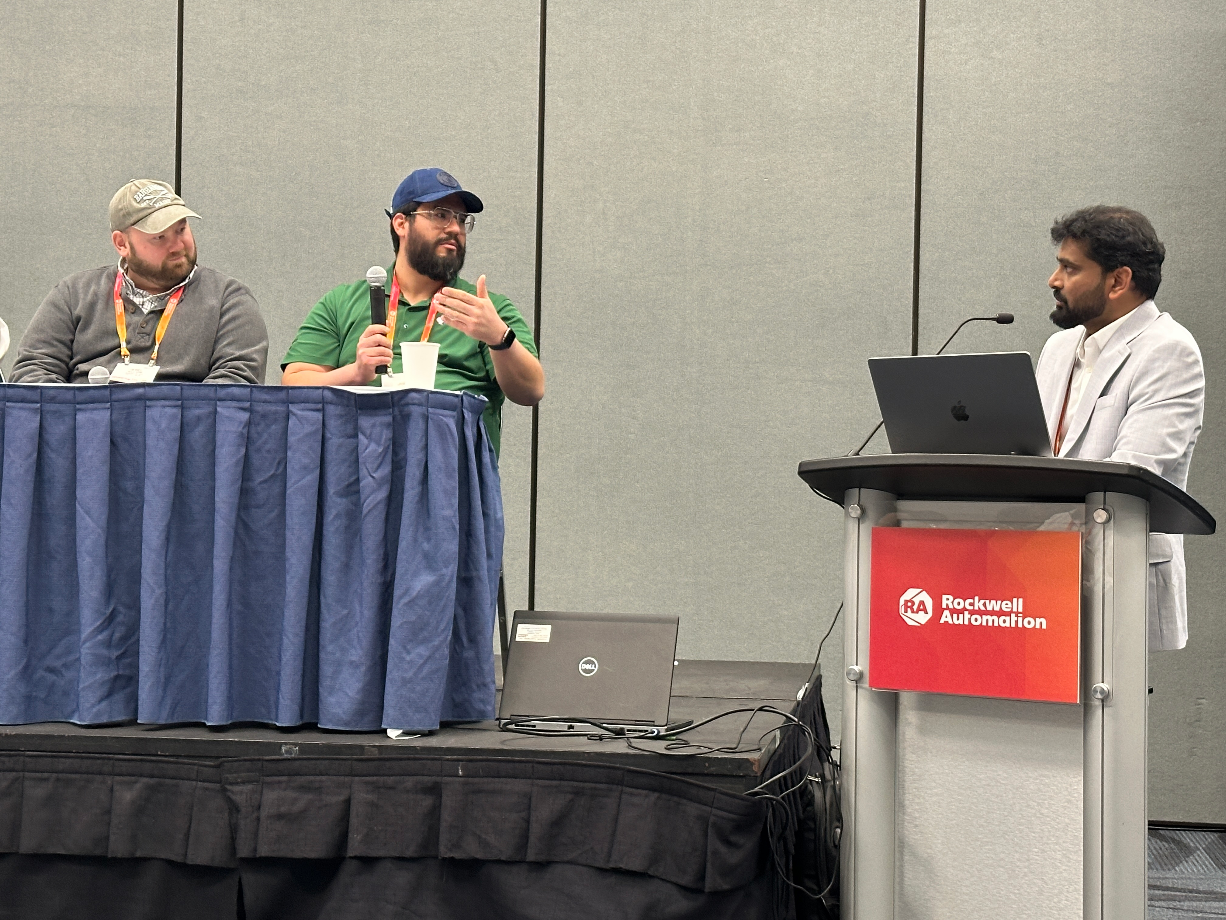 (from left) Jerel Williams and Juan Lua, automation managers at Danone, discuss FactoryTalk AssetCentre with Sharath Chander Reddy Baddam, software product engineer, Rockwell.