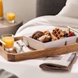 The new Bento box-style serviceware used for in-room breakfast service onboard Norwegian Cruise Line’s ships is reusable up to ‘potentially thousands of times’ and is made from 50% recycled PET from molecular recycling.