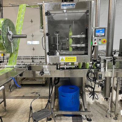 Shrink sleeving rollstock from Blue Label Packaging Co. on an AFM shrink sleever.