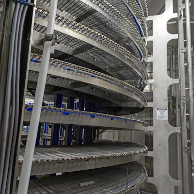 While spiral freezing units are mostly automated, food producers are experiencing labor challenges upstream and downstream with operations. Image courtesy of JBT Corp