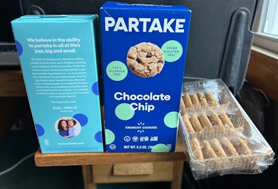 Shown here are round cookies that the COOKIEBOT is placing into three-cell 15-count trays.