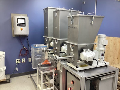 Three gain-in-weight Versifeeders from Vibra Screw deliver more accuracy and require less labor for Gharana Foods. Image courtesy of Joyce Fassl